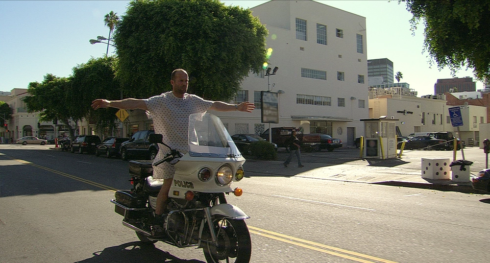 Jason Statham riding motorcycle